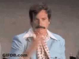 Man With Mustache In Blue Jacket And Scarf GIF