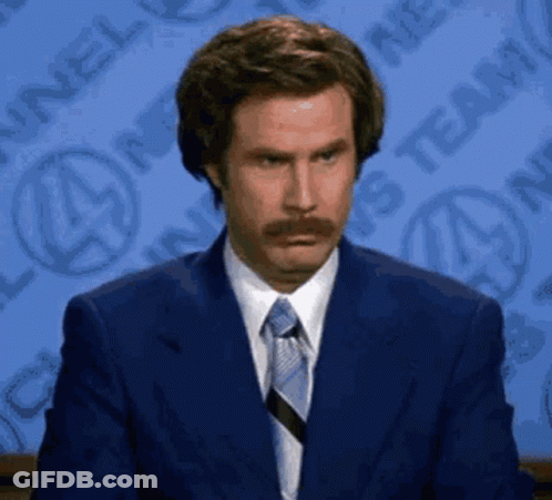 Man With Mustache In Blue Suit And Tie GIF
