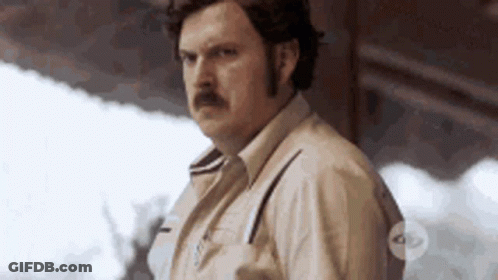 Man With Mustache In Front Of Building GIF