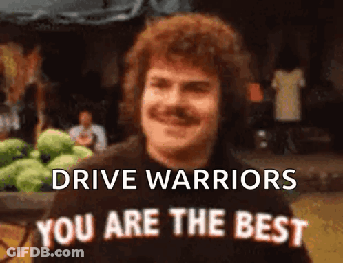 Man With Mustache In Front Of Drive Warriors Sign GIF