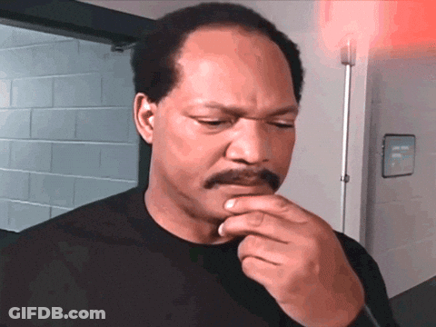 Man With Mustache In Front Of Emergency Exit Sign GIF