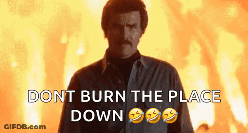Man With Mustache In Front Of Fire GIF