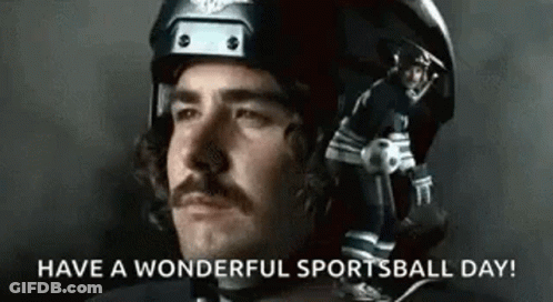 Man With Mustache In Helmet Holding Football And Soccer Ball GIF
