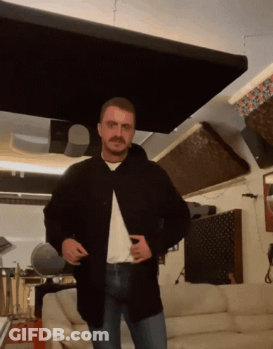 Man With Mustache In Living Room GIF