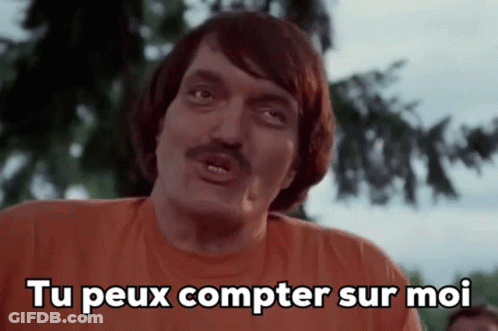 Man With Mustache In Orange Shirt Saying Tu Peux Compter Sur Moi GIF