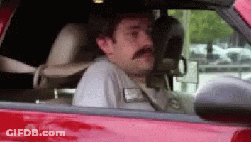 Man With Mustache In Red Car GIF