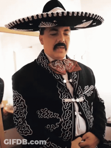 Man With Mustache In Sombrero And Jacket GIF
