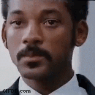 Man With Mustache In Suit And Tie Making Funny Face GIF