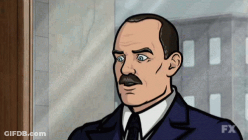 Man With Mustache In Suit And Tie Standing In Front Of Window GIF