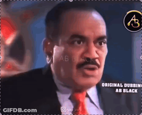 Man With Mustache In Suit And Tie Talking To Someone GIF