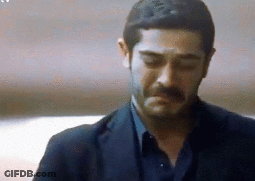 Man With Mustache In Suit Looking Down Eyes Closed GIF