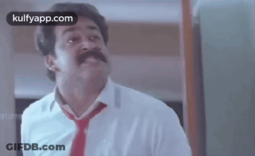 Man With Mustache In White Shirt And Red Tie Making Funny Face GIF