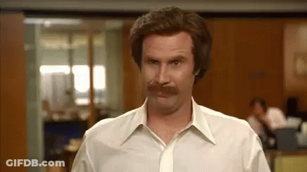 Man With Mustache In White Shirt And Tie Standing In Office GIF
