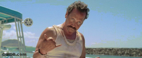 Man With Mustache In White Tank Top Sitting On Boat GIF