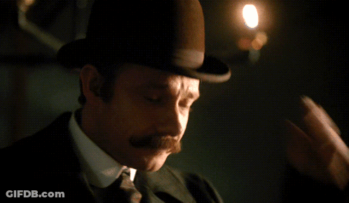 Man With Mustache Looking At Camera GIF