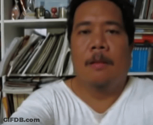 Man With Mustache Looking At Camera GIF