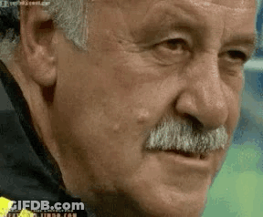 Man With Mustache Looking At Camera GIF