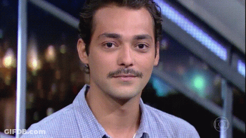 Man With Mustache Looking At Camera GIF