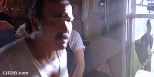Man With Mustache Looking Out Window GIF