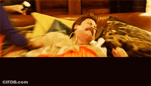 Man With Mustache Lying On Bed Screaming GIF