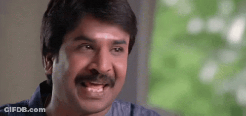 Man With Mustache Making Funny Face At Camera GIF