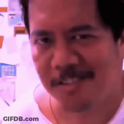 Man With Mustache Making Funny Face At Camera GIF