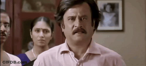 Man With Mustache Making Funny Face Before Group GIF