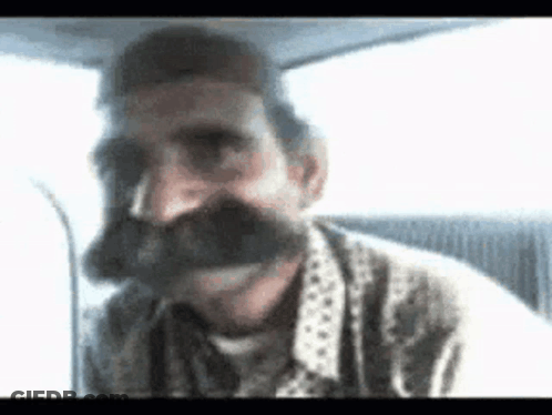 Man With Mustache Making Funny Face GIF