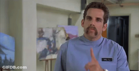 Man With Mustache Making Shhh Gesture GIF