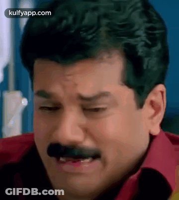 Man With Mustache Red Shirt Making Funny Face GIF
