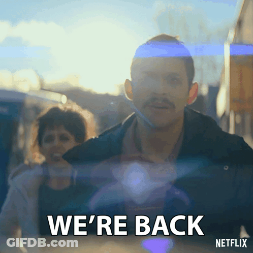 Man With Mustache Saying We're Back To Woman GIF