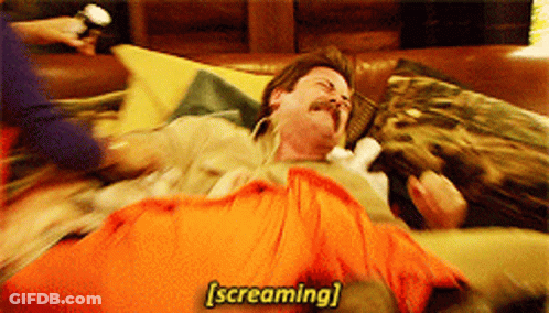 Man With Mustache Screaming On Couch GIF