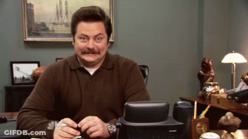 Man With Mustache Sitting At Desk With Telephone GIF