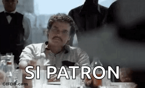 Man With Mustache Sitting At Table GIF