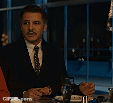 Man With Mustache Sitting At Table With Glass Of Water GIF