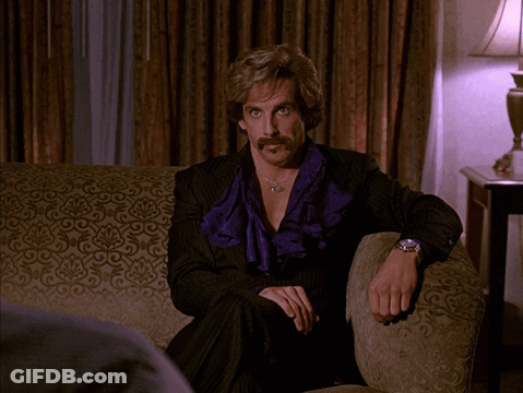 Man With Mustache Sitting On Couch Saying I Mean Come On GIF