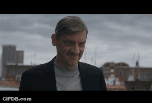 Man With Mustache Smiling City Skyline GIF