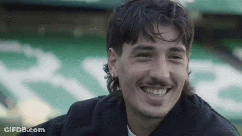 Man With Mustache Smiling In Front Of R.E. Sign GIF