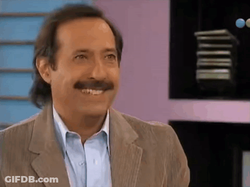 Man With Mustache Smiling In Suit And Blue Shirt GIF