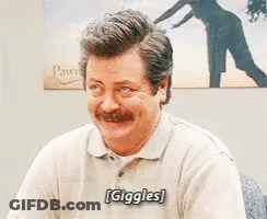 Man With Mustache Smiling Laughing In Front Of Picture GIF