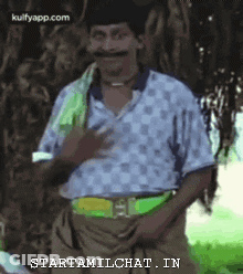 Man With Mustache Standing By Tree GIF