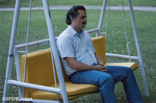 Man With Mustache Standing By Wall GIF