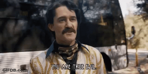 Man With Mustache Standing In Front Of Bus GIF