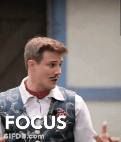 Man With Mustache Standing In Front Of Focus GIF