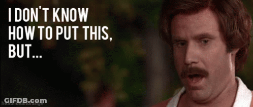 Man With Mustache Standing In Front Of Sign Saying I Don't Know How To Put This But GIF