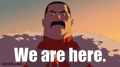 Man With Mustache Standing In Front Of We Are Here Sign GIF