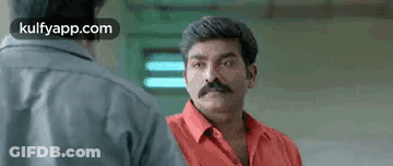 Man With Mustache Standing Next To Another Man GIF