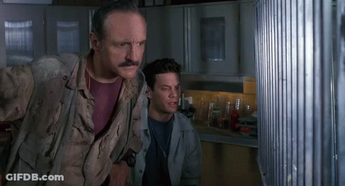 Man With Mustache Standing Next To Another Man In Kitchen GIF