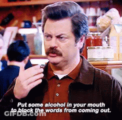 Man With Mustache Talking Into Microphone Holding Wine GIF