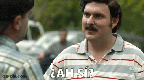 Man With Mustache Talking Man In ¿Ah Sí? Shirt GIF